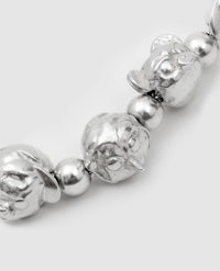 a silver bead bracelet with a pair of elephants on it